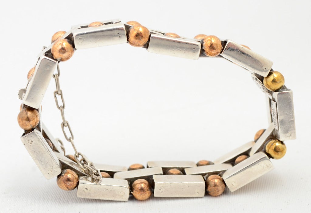 Rectangular silver links are combined with copper balls in this wonderful bracelet by silver master, William Spratling. Hallmark dates it to the 1940's. Measures 1/2