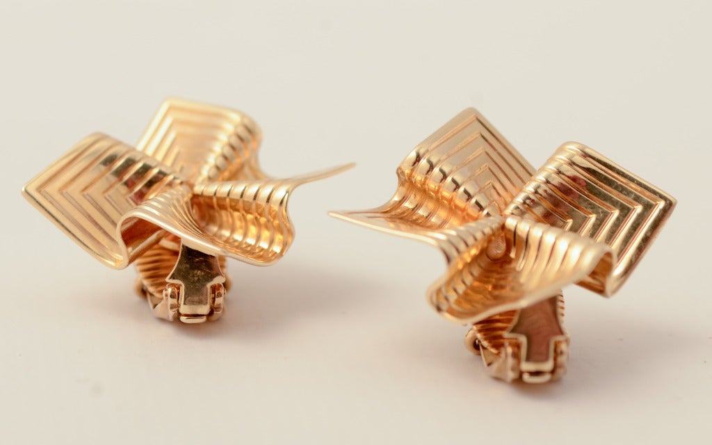 Sculptural earrings by Tiffany and Co. known as their Origami design. Measure 11'16