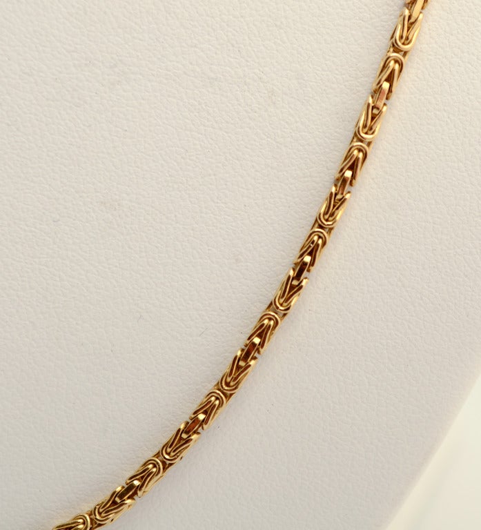 This Intricately woven long 18 karat gold chain by Buccellati is very versatile. It measures 31 1/2