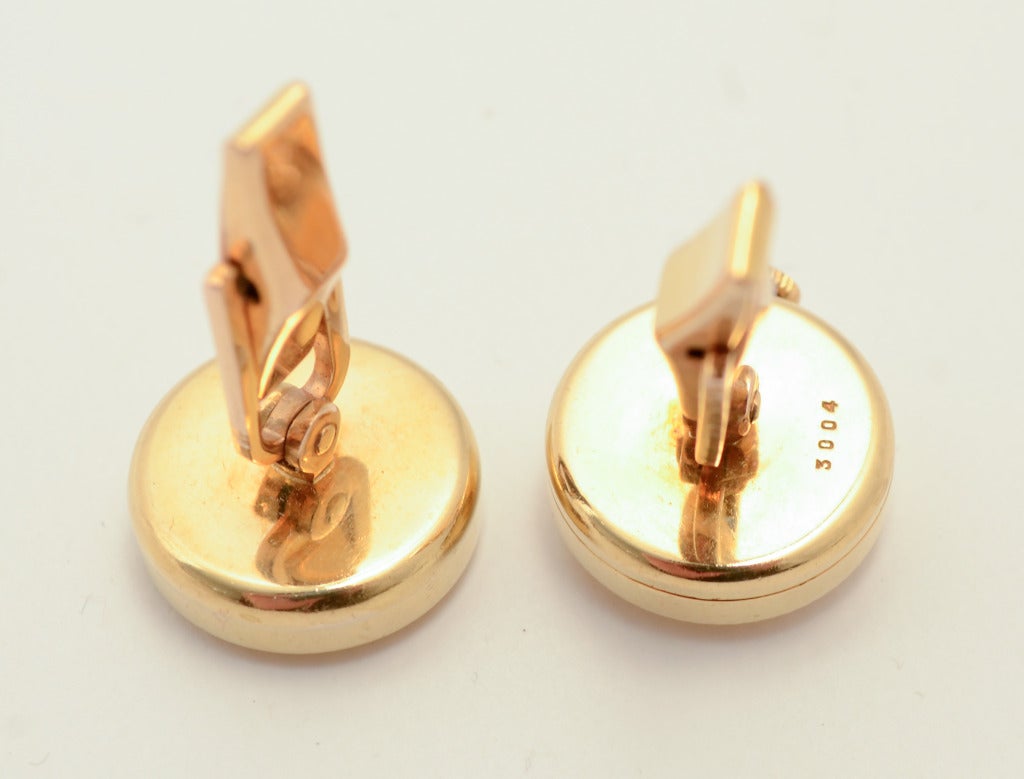 Unusual 18k yellow gold cufflinks by Swiss watchmaker Carl Bucherer, in which one of the links is a working watch. Bucherer was known for his expertise both as a watchmaker and jewelry designer and these cufflinks beautifully illustrate both.
