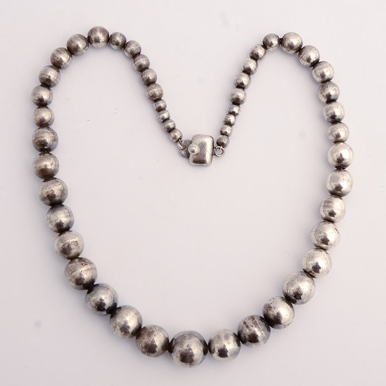 Early silver beads by silver master, William Spratling. The graduated strand measures 20