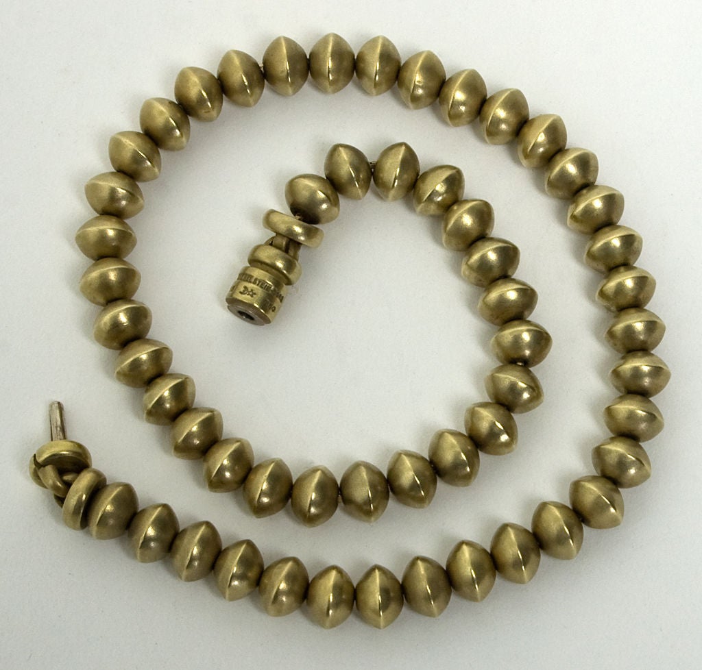Heavy weight eighteen karat gold beads by Barry Kieselstein Cord, done in the matte finish that easily identifies his jewelry. They are reminiscent of the shape of ancient Native American and Mexican beads, making them timeless and cross cultural,
