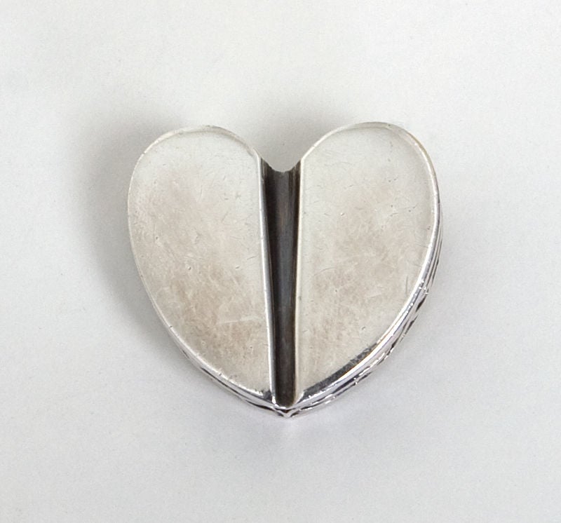 Three dimensional silver heart brooch by Barry Kieselstein-Cord. The sides and back are as well designed as the front. Measures 1 1/2