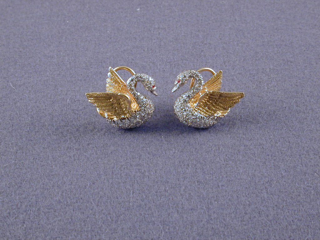 SUSAN LEE GRANT Sculptured Swan earclips , diamond set head neck and wings, engraved gold outspread wings