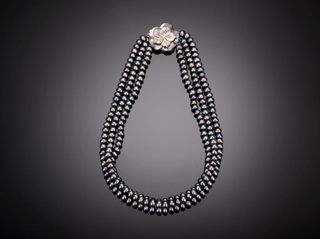 Three strands of stunning freshwater black pearls, measuring from 18