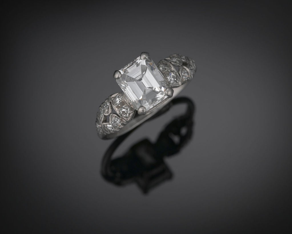 An Internally Flawless 1.87-carat emerald cut diamond shines in this elegant ring. Exhibiting the rare and spectacular D-color, the finest and most uncommon coloring found in white diamonds, this lovely gem is nestled in a beautifully pierced