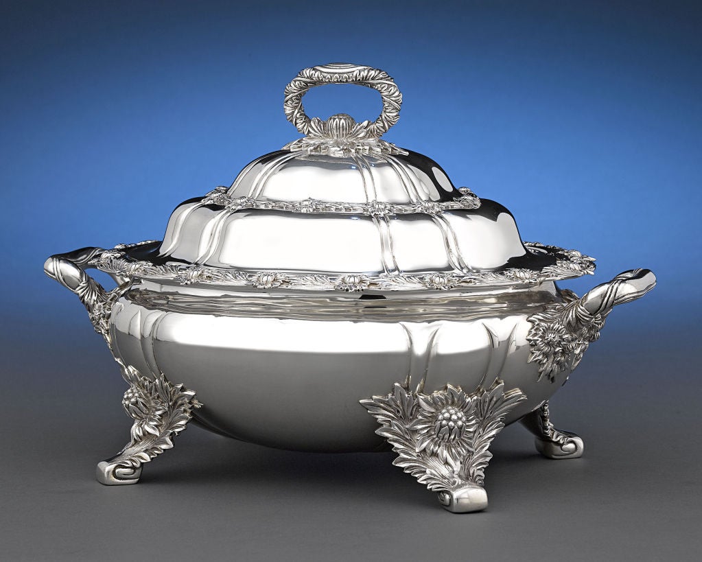 The magnificent covered sterling silver entrée dish by Tiffany & Co. is crafted in the iconic chrysanthemum pattern. Gloriously chased on the rim and outer body with intricately worked namesake flowers, this incredible antique bowl embodies the