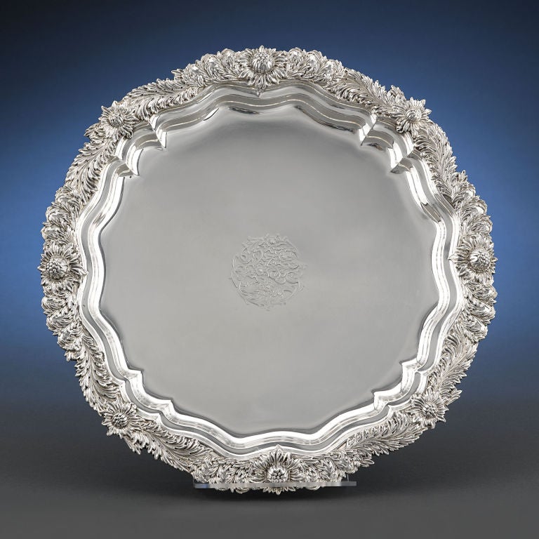 A splendid sterling silver round tray from the incomparable Tiffany & Co., in the widely recognized Chrysanthemum pattern, exhibiting the finest level of American silver craftsmanship. This footed tray embodies the very best qualities of the