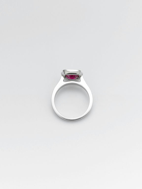 A rare and sumptuous Burma ruby is the star of this exquisite ring. Weighing approximately 1.02 carats and surrounded by approximately .30 carats of sparkling diamonds in its platinum setting, this thrilling gem displays the perfect 