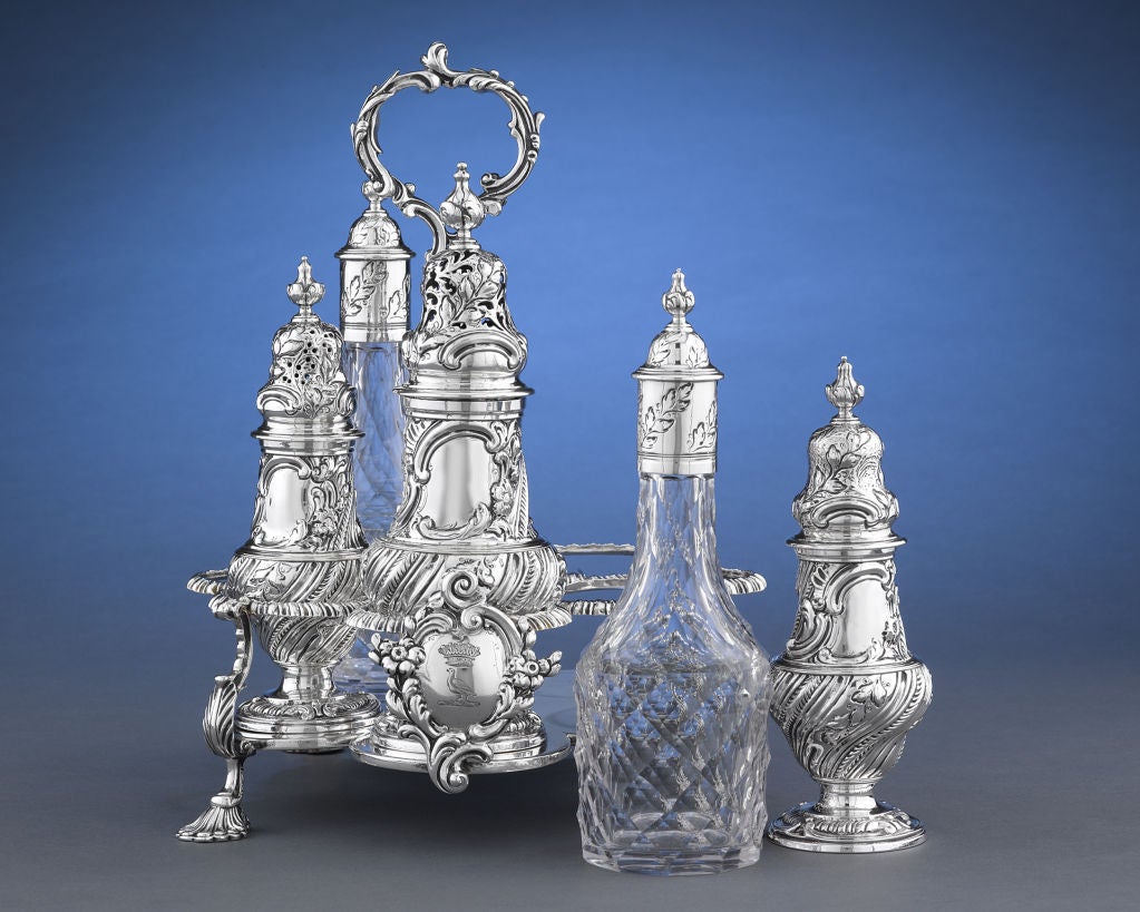 A complete and fully hallmarked George III-period silver cruet service in the Warwick form by Huguenot silversmith John Delmestre. Huguenot silversmiths working in London during the late 17th through the mid-18th centuries produced some of the most