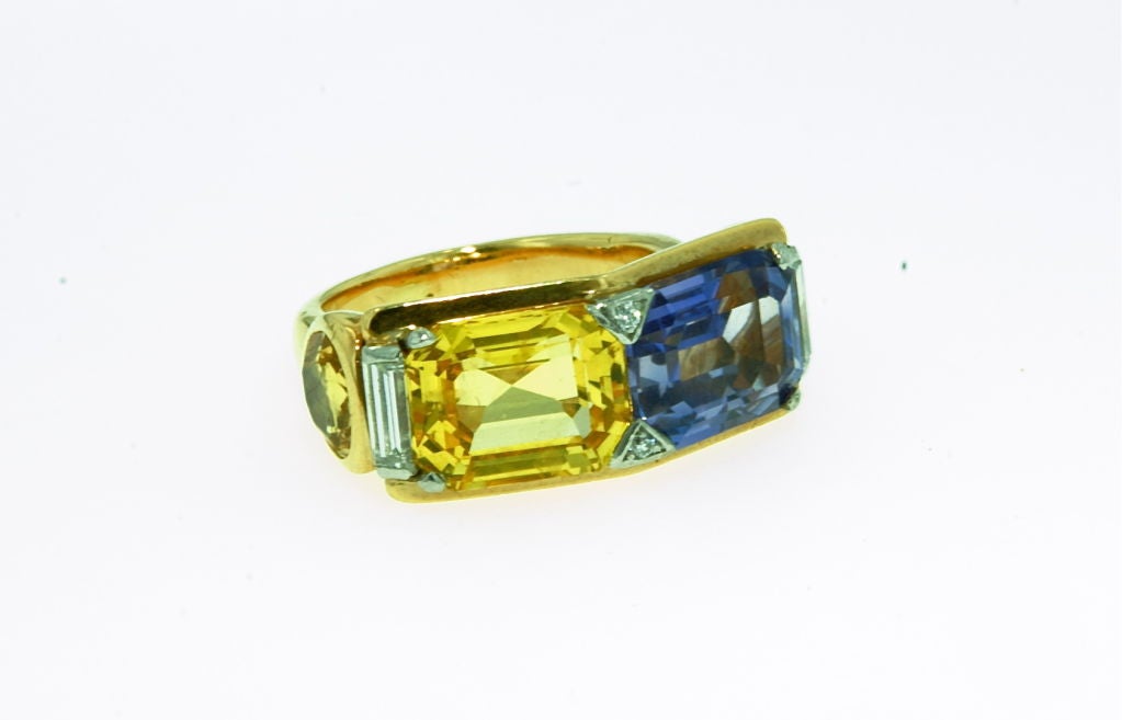 4.67ct yellow and 5.41 ct blue sapphires mounted in pristine 18k gold mounting with diamond details