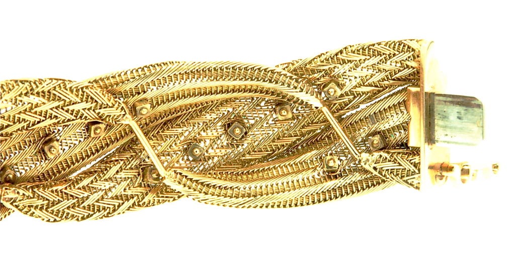 An 18k Yellow Gold Mesh Bracelet with Diamonds and Emeralds.  Made in France and very chic!
