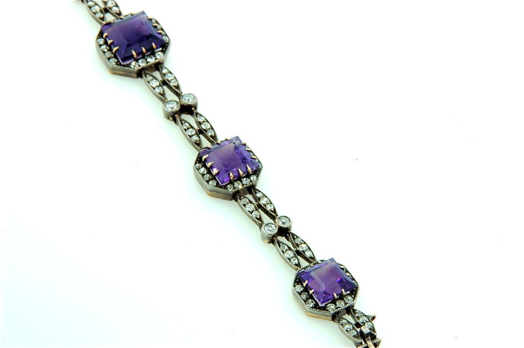 An Antique Bracelet with 5 rare Amethysts of amazing color set into a silver top, gold back mounting surrounded by  Antique cut Diamonds.