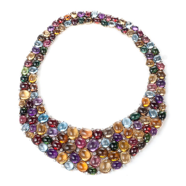 A Multi-Color Semi-Precious Cabochon and Diamond Bib Necklace. 125 multi color gemstones weigh approximately 1,500 carats. 125 Brilliant Diamonds used as accents weigh approximately 15 carats.