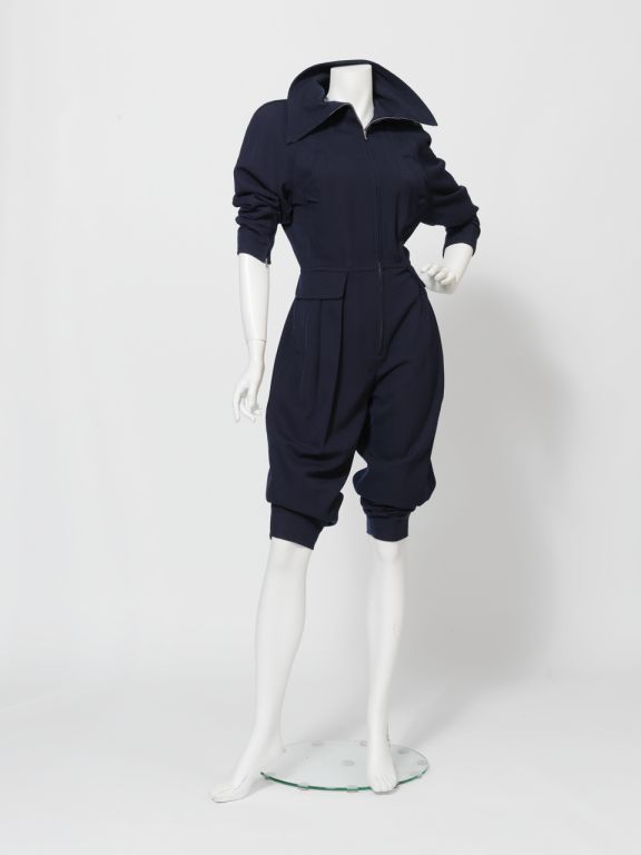1980s Courreges navy blue jumpsuit with zip-front closure. Impossibly trendy and versatile.

Waist pockets, zipper cuff sleeves, lightly padded shoulders