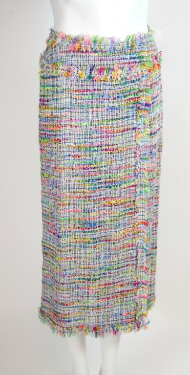 Fantastic rainbow colored woven long skirt from Chanel! Faux wrap style with slit halfway up. Lined in lightweight white mesh. Invisible zipper at center back.

Spring 1998 Collection