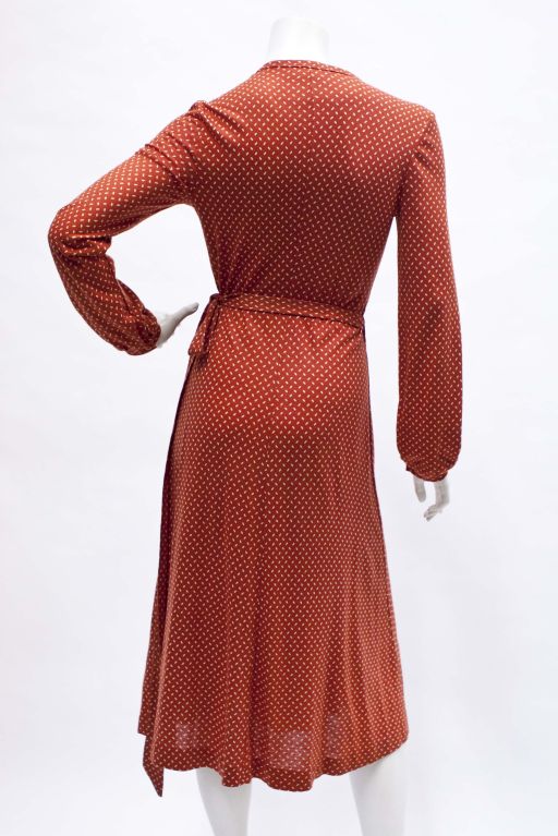 Quintessential Diane Von Furstenberg wrap dress in burnt sienna. Lovely delicate print.