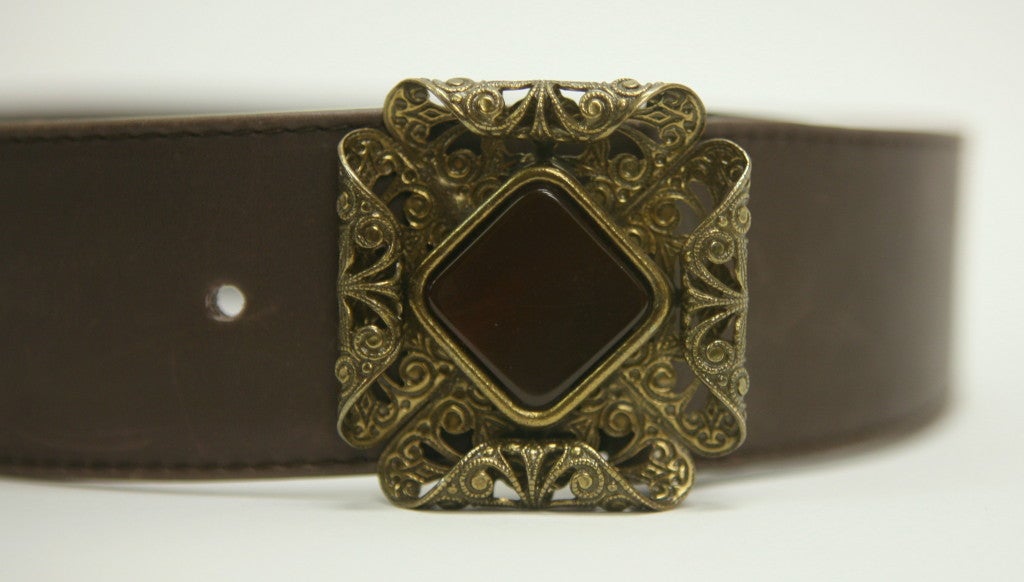 Unique vintage Gucci 60's belt with a gorgeous carved bronze buckle and a rust glass stone.

33
