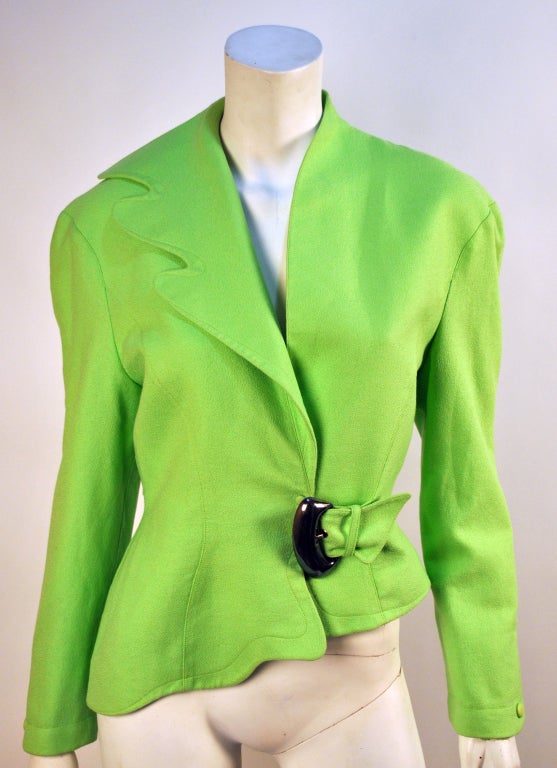 Circa 1980's Thierry Mugler Asymmetrical Neon jacket! This little gem is a size 4 to a small 6, and in great condition. The design is just outstanding and the color is rather eye catching!