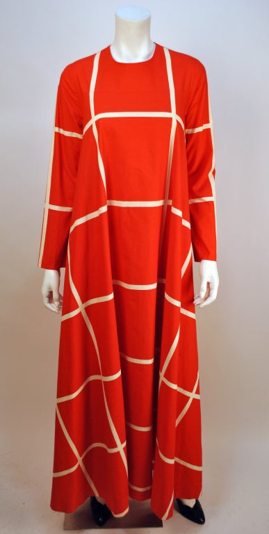Vintage Vuokko graphic print red and white checkered maxi dress is a beautiful example of the freedom of fashion for women in the 1960s. This Work of Art is both playful and dramatic with yards of fabric sewn into panels to create endless movement