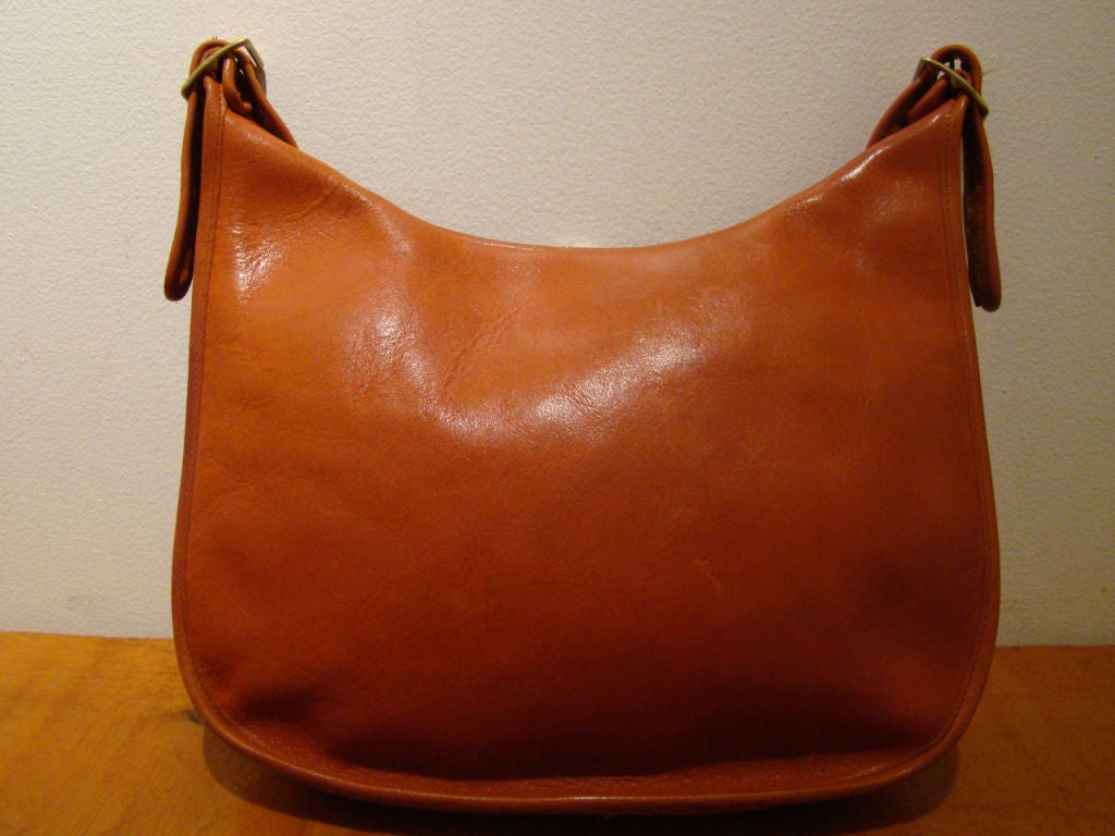 Beautiful vintage Coach leather bag, designed by Bonnie Cashin.  Fantastic design, with adjustable short strap and original Coach tag.  Stylish and versatile.