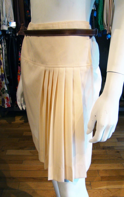 Fantastic vintage Gucci skirt from the early 1980's.  Cream colored, with wrap design, original leather belt and great pleating.  Gorgeous piece!