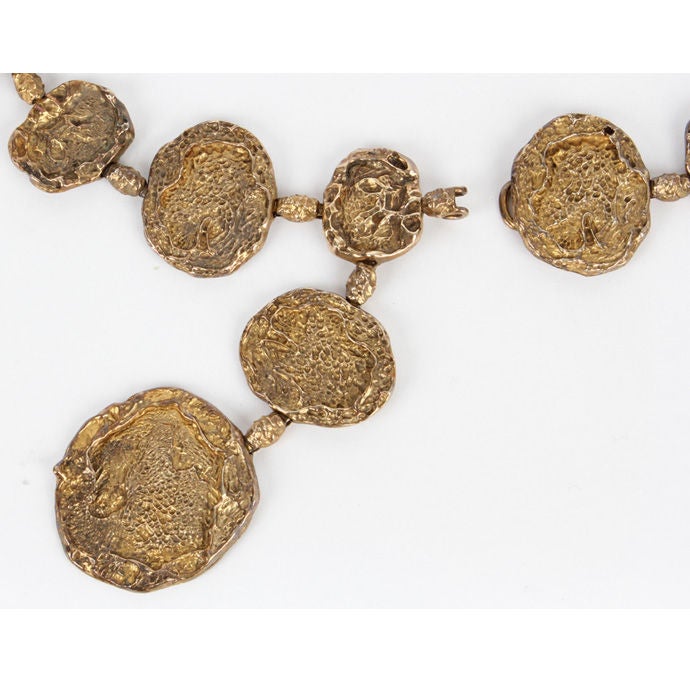 This belt was famously worn by Jackie Onnassis' on a trip to Capri and was much photographed. Beyond cool, early 1970's Cartier Belt- the absolute essence of chic. <br />
<br />
The heavily pitted medallions reminicent of the surface of the moon