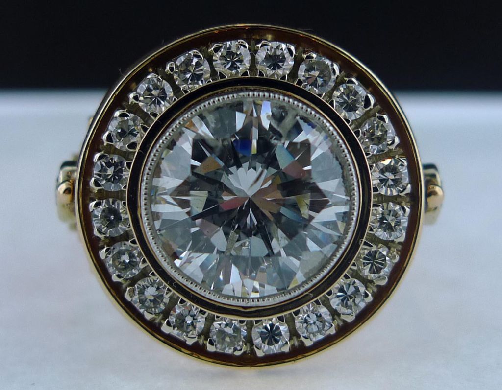 Estate Russian diamond and ruby ring, set in 18K rose gold.  The central diamond is 4.16 cts of SI-2 clarity, color G.  Central stone is surrounded by 20 full cut round diamonds.  Stones  (including rubies) also decorate the elaborate undercarriage