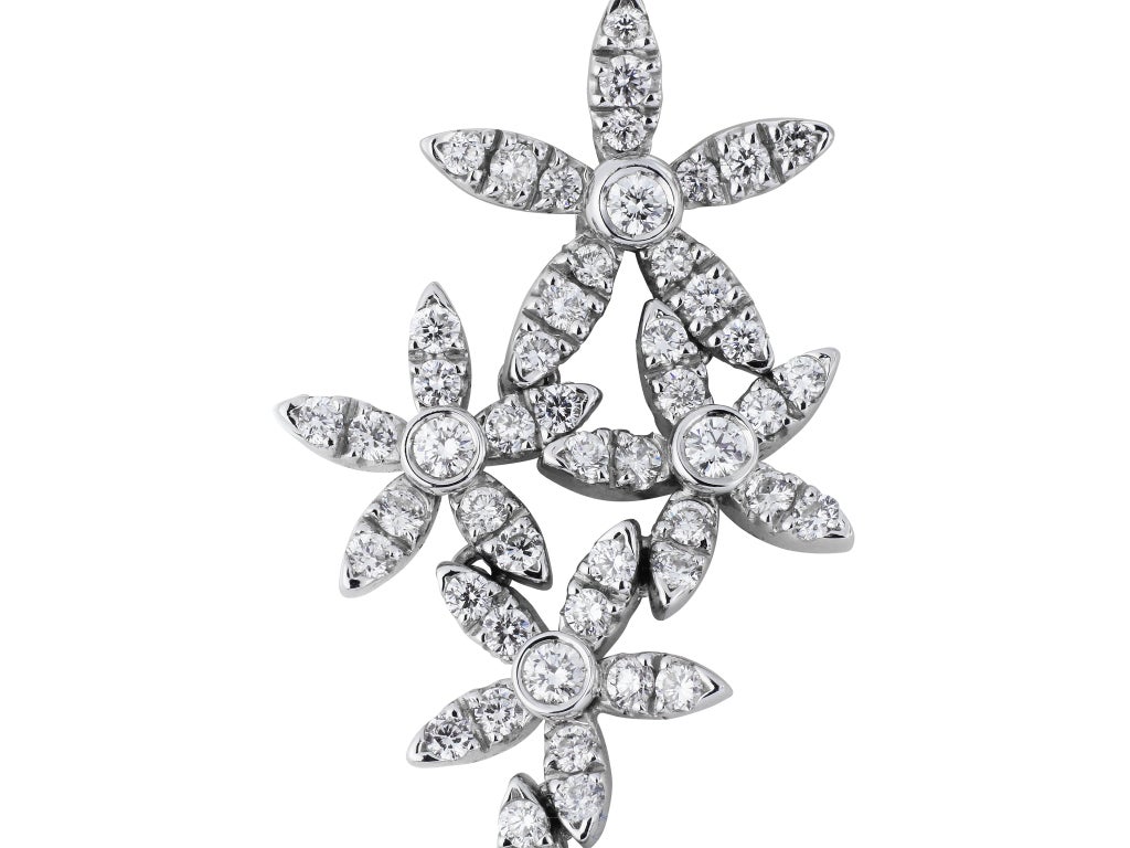 18 karat white gold floral motif drop earrings consisting of 3.08 carats total weight of full cut diamonds, signed asprey.