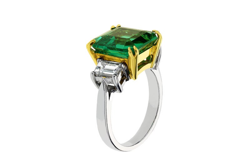 Platinum and 18 karat yellow gold custom made 3 stone ring consisting of 1 square emerald cut Colombian emerald weighing 6.01 carats measuring 11.99 x 11.55 x 7.41mm with C. Dunaigre certificate CDC 1201145 stating Vivid green, minor enhancement,