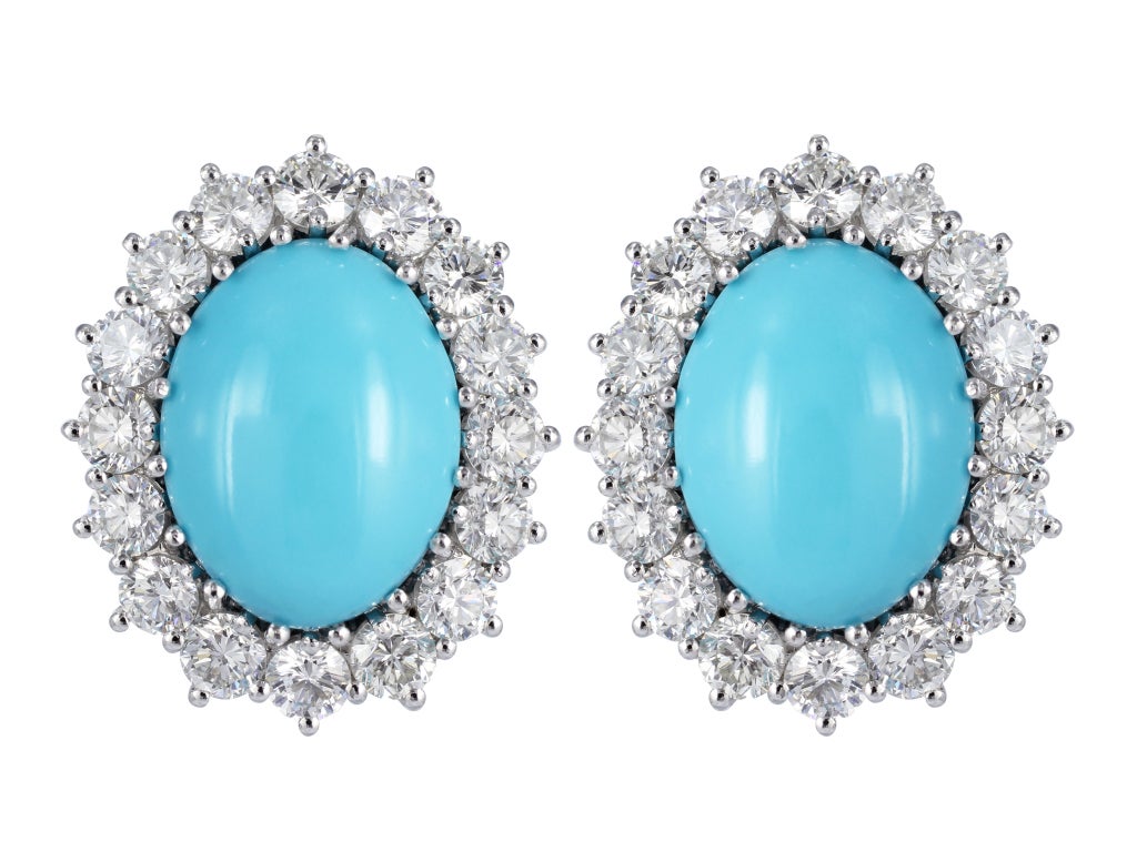 18 karat white gold cluster necklace & earrings set consisting of approximately 30 carats total weight of round brilliant cut and baguette diamonds set with 13 pieces of cabochon turquoise, signed Chantecler Capri.