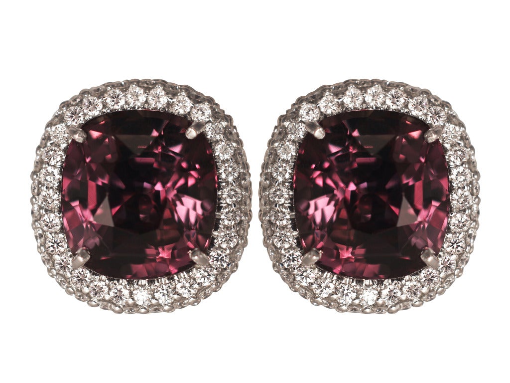 Platinum cluster earrings consisting of 1 cushion cut Alexandrite weighing of 6.03 carats with AGL certificate CS 55403, and 1 Alexandrite weighing 6.15 carats with AGL certificate #CS 55402, the center stones are set with 1.25 carats total weight