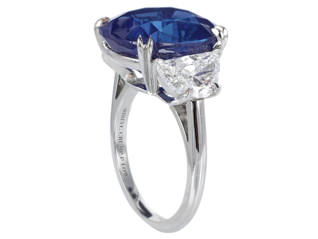 Platinum custom made three stone ring consisting of 1 cushion cut Natural Gem Kashmir sapphire, weighing 14.54 carats, measuring 14.39 x 12.86 x 8.41 mm and Gubelin report 12055254, GIA report 5151389025, and AGL report CS 42693 stating the stone
