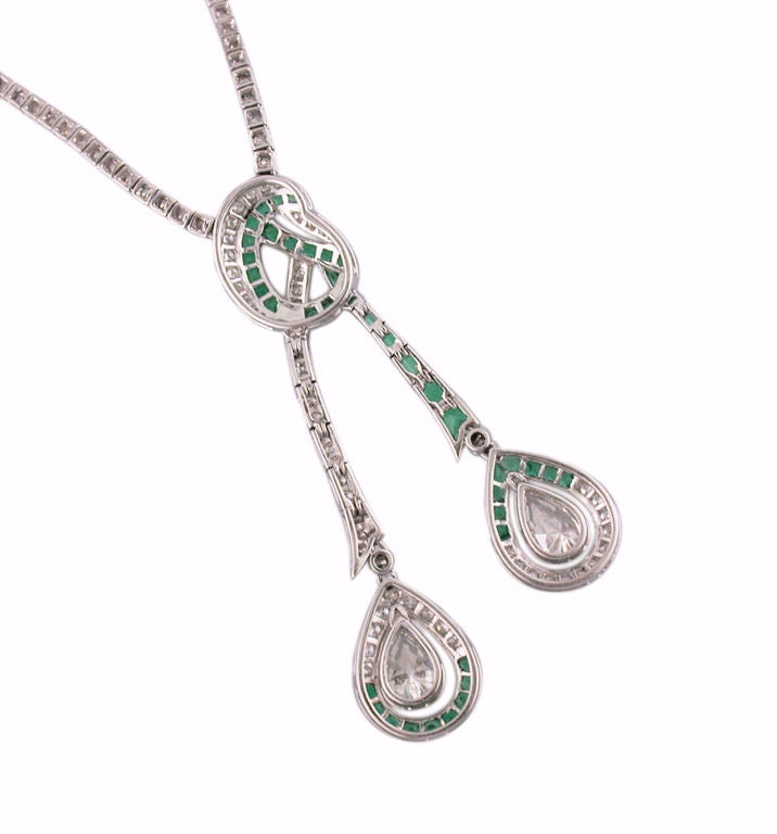 Lovely platinum double drop necklace, consisting of calibre cut emeralds weighing 2.89 total carats and round brillant cut Diamonds weighing 3.97 total carats, and two pear shape Diamonds, one weighing .89 carats and the other .75 carats.  The