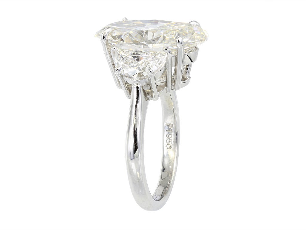 Contemporary Oval Diamond Three Stone Engagement Ring