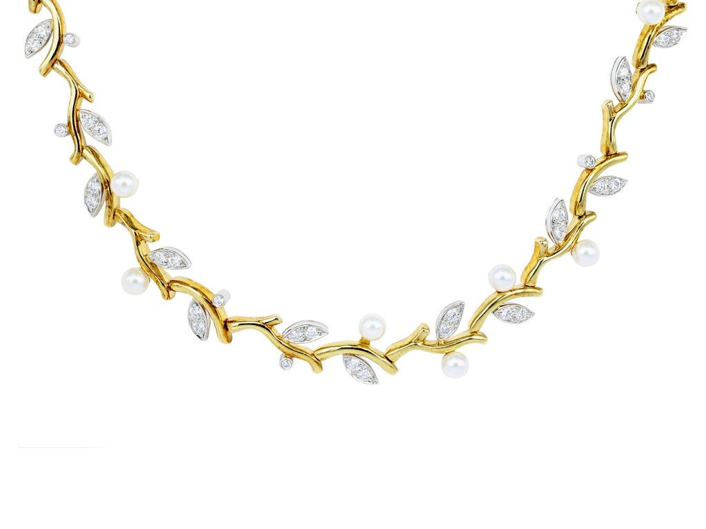 Platinum and 18 karat yellow gold Garland necklace consisting of approximately 2.12 carats total weight of round brilliant cut diamonds and pearl accents, the necklace is signed Tiffany & Co. Matching Platinum and 18 karat yellow gold Garland