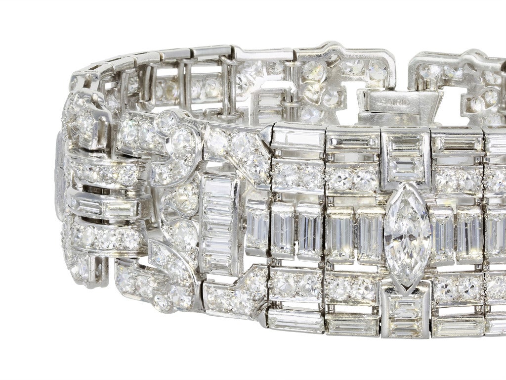 Platinum estate diamond flexible bracelet. Signed Cartier circa 1925. Consisting of an assortment of round brilliant, old European and straight baguette cut diamonds haviing an approximate total weight of 25 carats