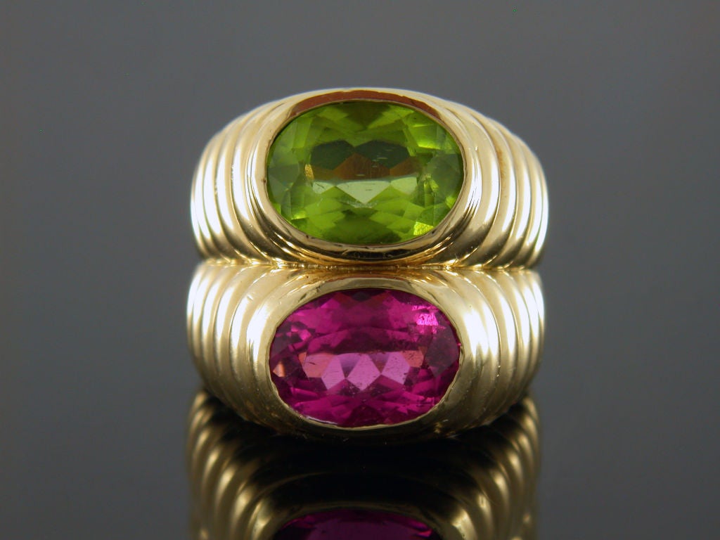 18kt yellow gold Bulgari pink tourmaline and green peridot by pass ring.