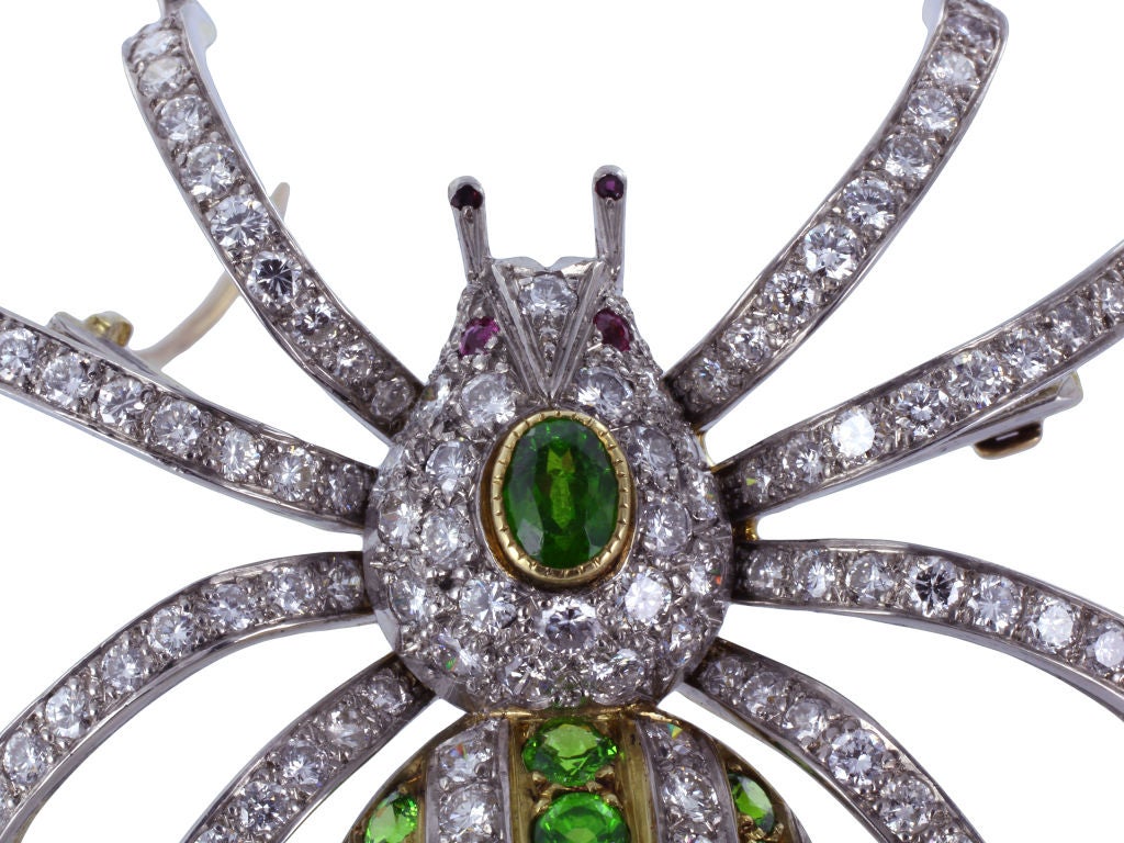 This intricate and unique vintage pin is a beautiful way to make a statement. The spider is crafted in Platinum on 18 karat yellow gold. The body and legs are set with gorgeous full diamonds having an approximate total weight of 5.50 carats. The
