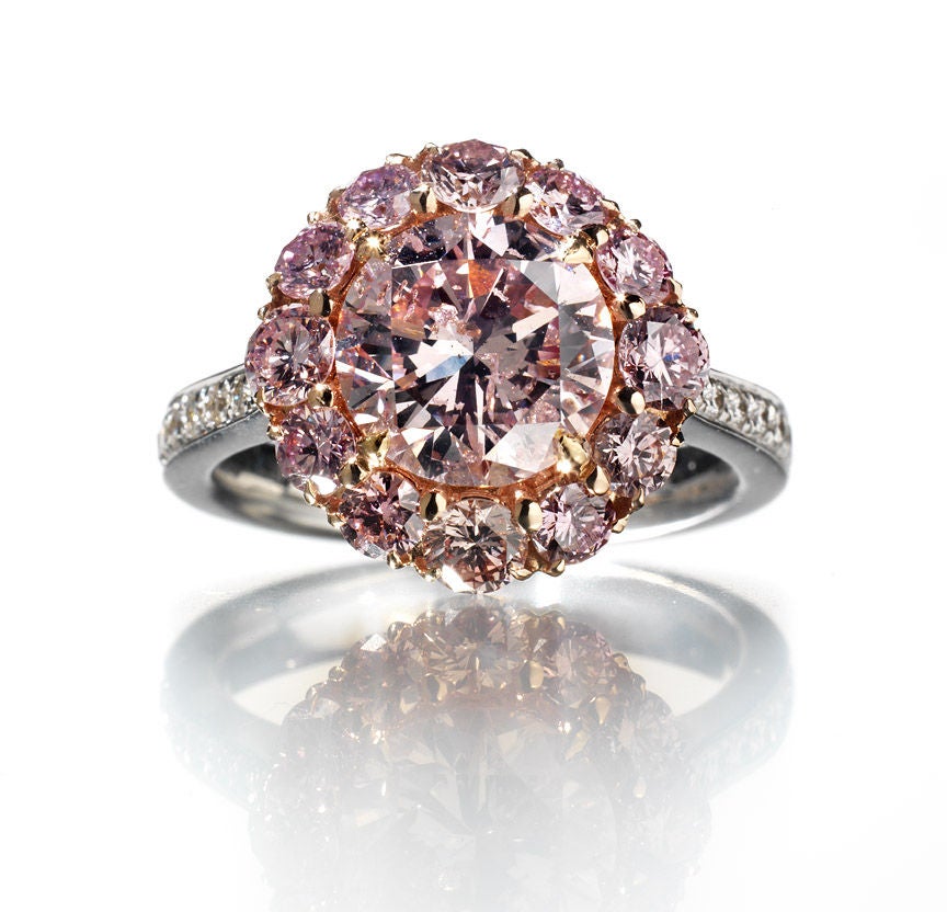 David and Co. is proud to present this extremely rare Fancy Pink Diamond ring.  This is a Natural Fancy Pink diamond weighing 2.50 carats in a Round Brillant Cut having a clarity of I2.  The pink diamond is set in cluster ring, the center stone is