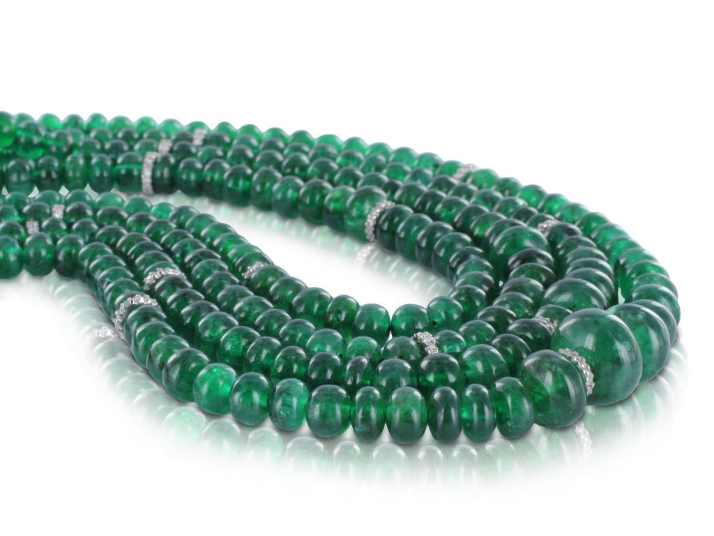 Platinum vintage necklace consisting of approximately 400 carats of emerald beads set with approximately 8.00 carats total weight of full cut and baguette diamonds in the clasp, signed David Webb.