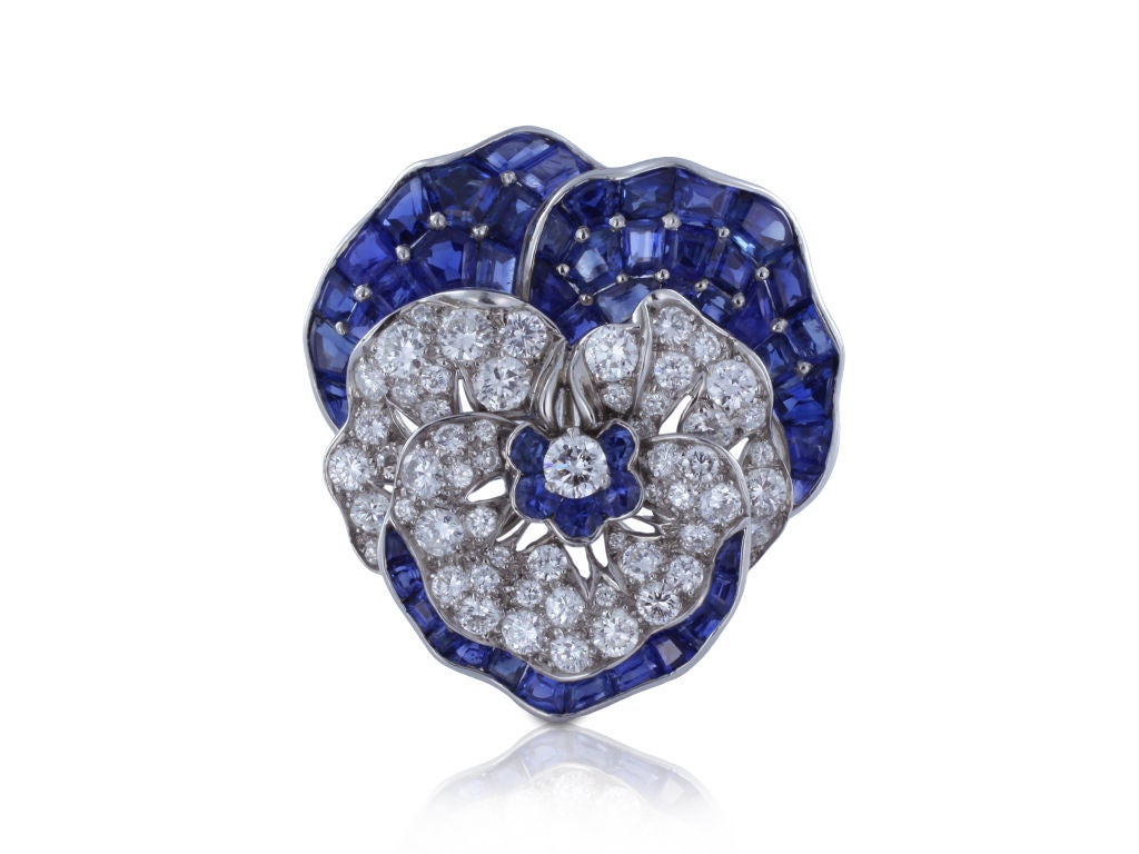 Oscar Heyman Brothers Platinum, Sapphire And Diamond Pansy Brooch, Circa 1910. The Pin Features Round Brilliant Cut Diamonds Having An Approximate Total Weight Of 3.00 Carats And Custom Cut Sapphires Having An Approximate Total Weight Of 9.00