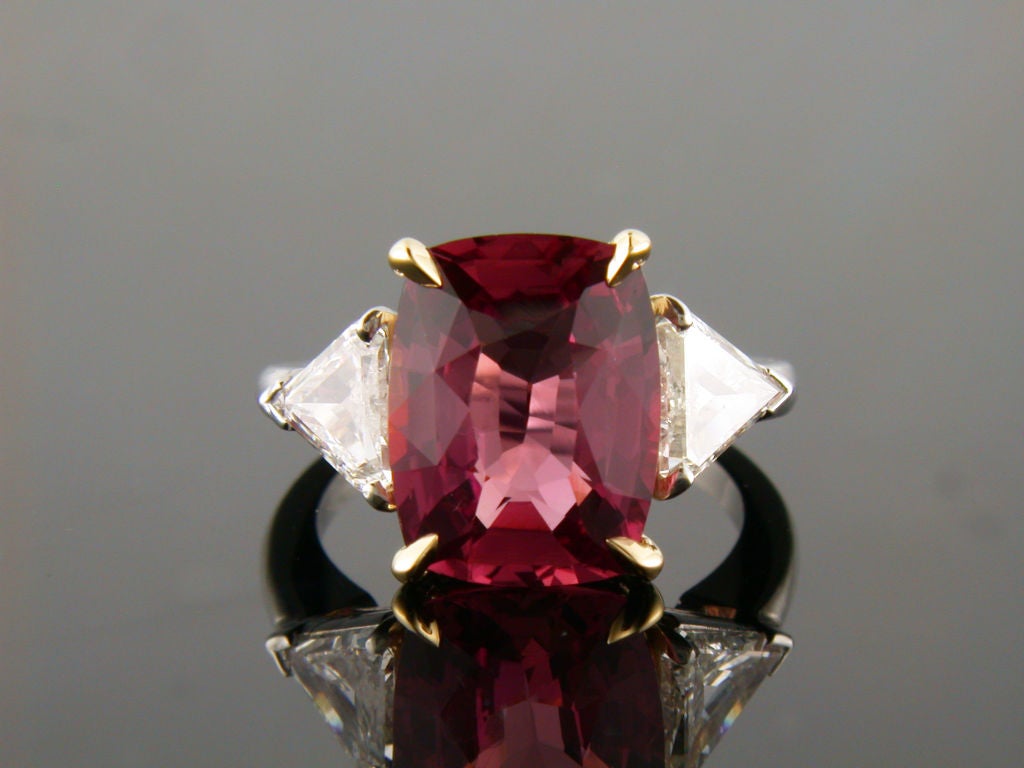 The term Padparadscha is derived from Sanskrit/Singhalese language refering to the lotus flower. This extremely rare sapphire is extremely desirable and higly valued. This custom made ring features a 7.08 carat Padparadscha sapphire, measuring 12.88