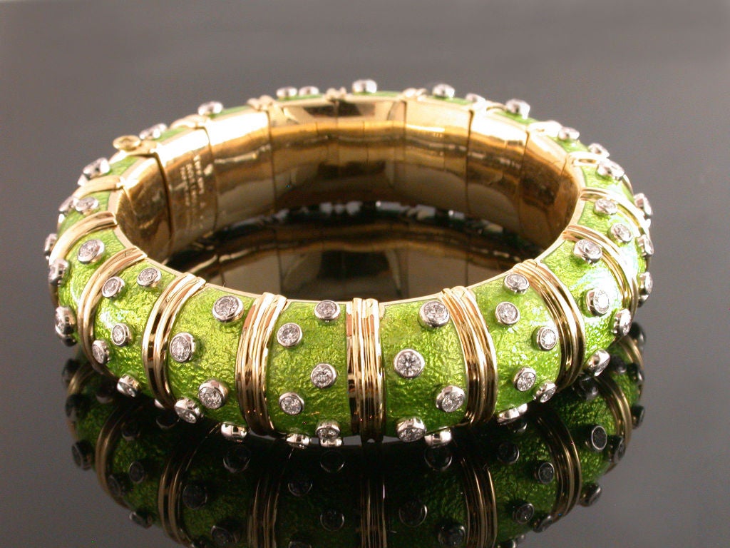 18kt yellow gold wide lime green paillonne enamel bangle bracelet with bezel set full cut diamond accents signed Tiffany & Co. Schlumberger