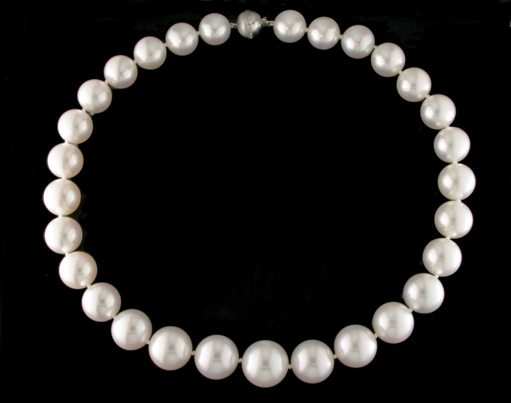 Classic and elegant white South Sea Pearl Necklace. This incredible necklace consists of 29 pearls graduating in size from 13mm-16.4mm each one hand knotted. The peices is 17.5 inches long and finished with an 18 karat white gold ball clasp with a
