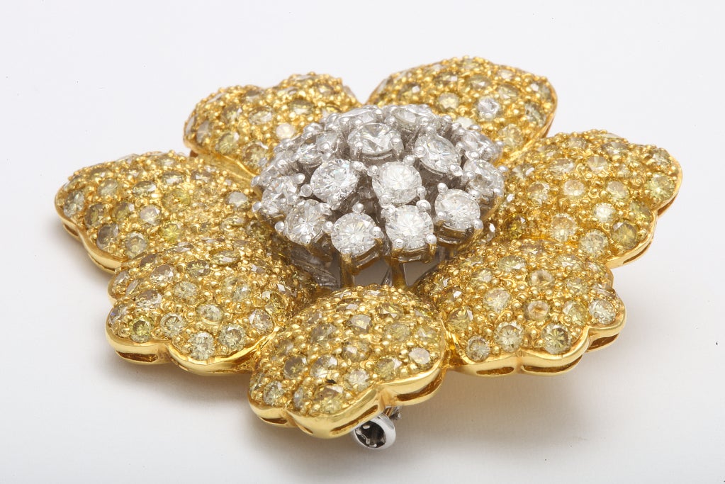 TWO TONE 18KY CONTEMPORARY FLOWER PIN / BROOCH.  THERE IS 2.69CT IN WHOTE DIAMONDS AND 8.11 IN YELLOW DIAMONDS