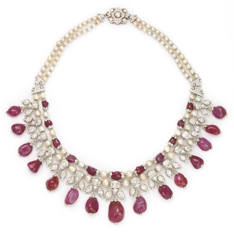 Set of18K White Gold Ruby Bead, Diamond, and Pearl Necklace and Pendant Earrings

Necklace: 26 Ruby Beads appx. 148.00cts

Estimated diamond weight: 21.80cts