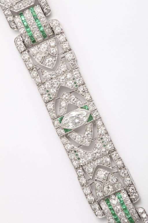 Platinum bracelet is set with emerald and diamonds.

Estimated marquise diamond weight: 3.00ct
Estimated melee diamond weight: 6.42ct
Estimated emerald weight: 3.04ct
