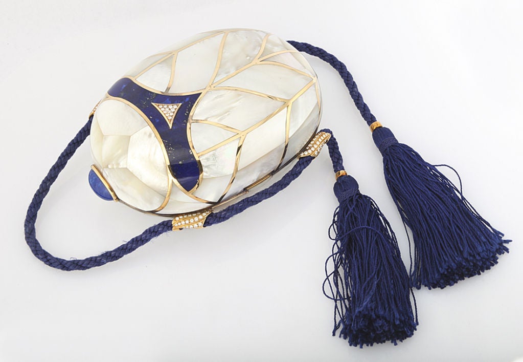 Extraordinary Fred Paris evening bag made to order by royal commission in the 1980's, 18KT gold layered with pearl and lapis, set with diamonds, hung from cord, suede lined interior with bevel mirror. 6 x 4 1/2 x 2 1/2 inches. Fred mark.