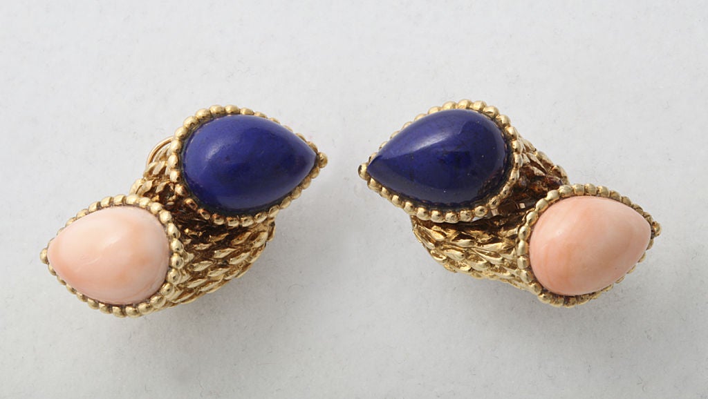 Boucheron 18KT gold cornucopia earclips set with large teardrop cabochons of lapis and coral. Boucheron mark. 1 1/2 inch long.